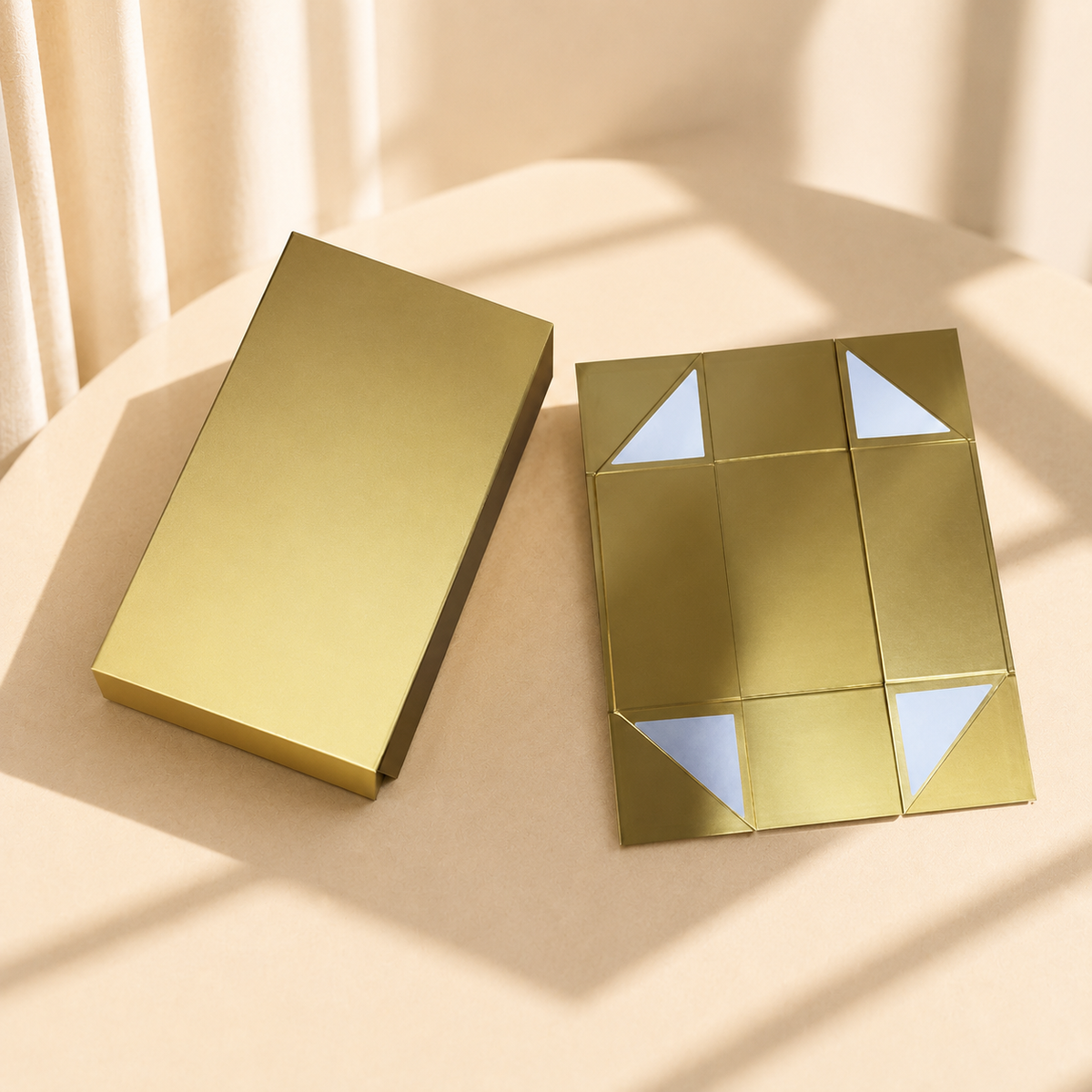 Gold collapsible magnetic gift box shown closed and flat