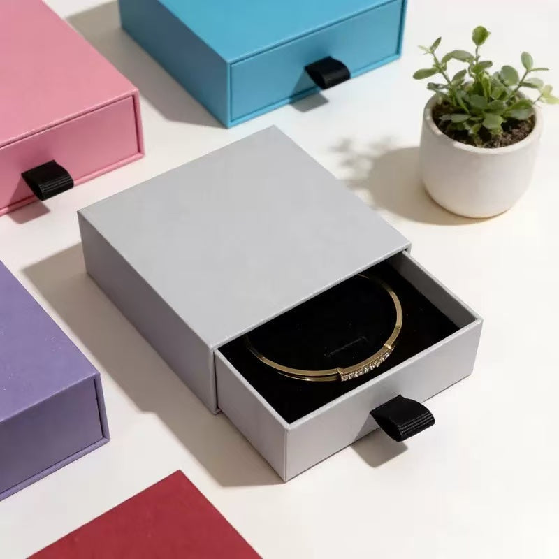 Custom sliding drawer jewelry box with ribbon pull and fitted insert