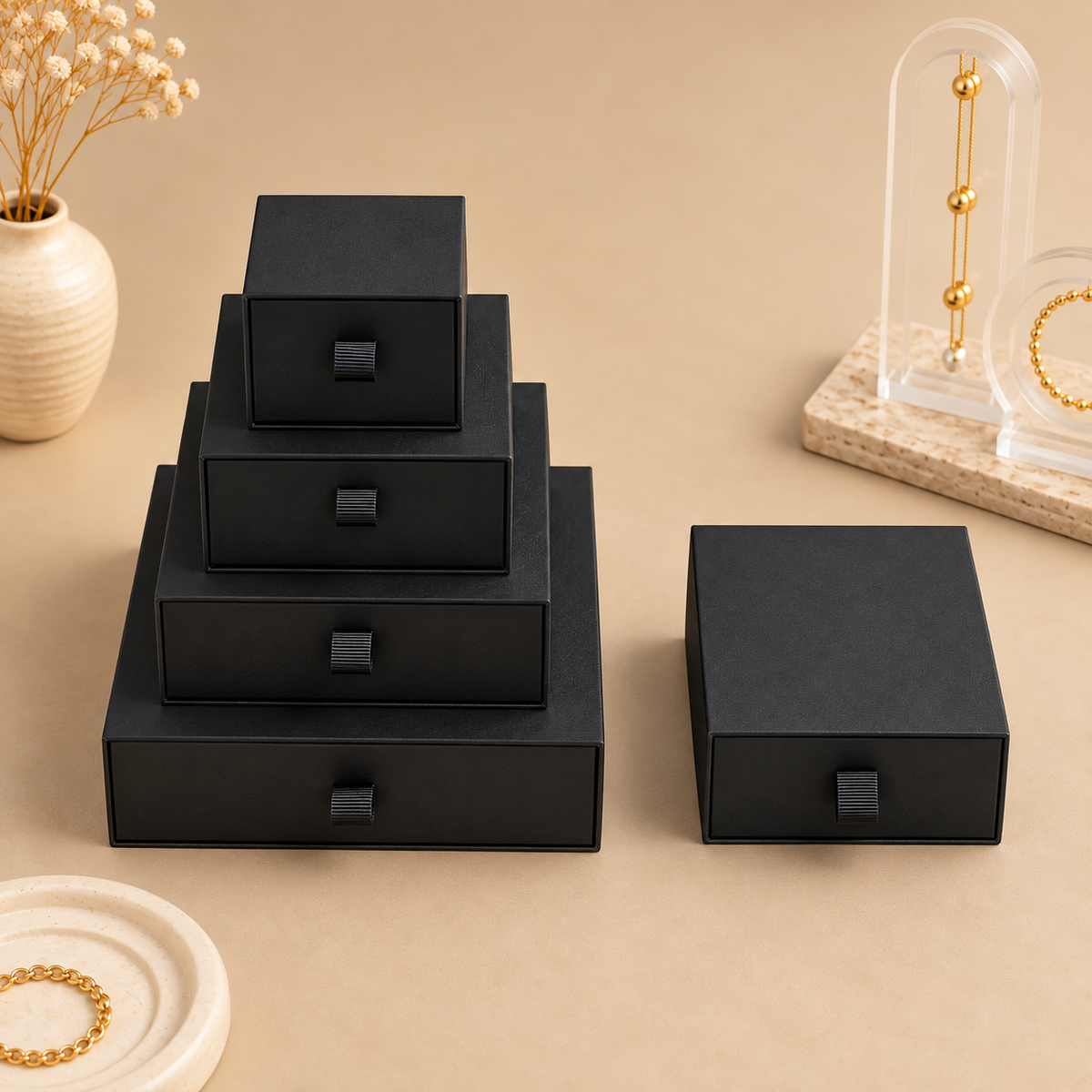 Black paper drawer jewelry boxes shown in the five size options